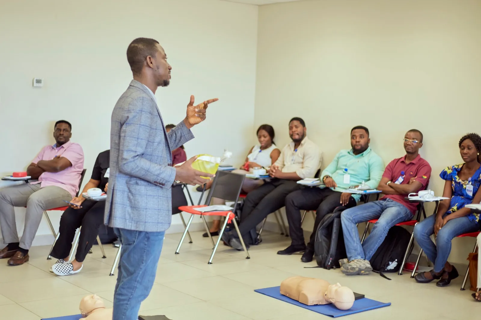 Group of corporate professionals receiving AHA certification training on-site