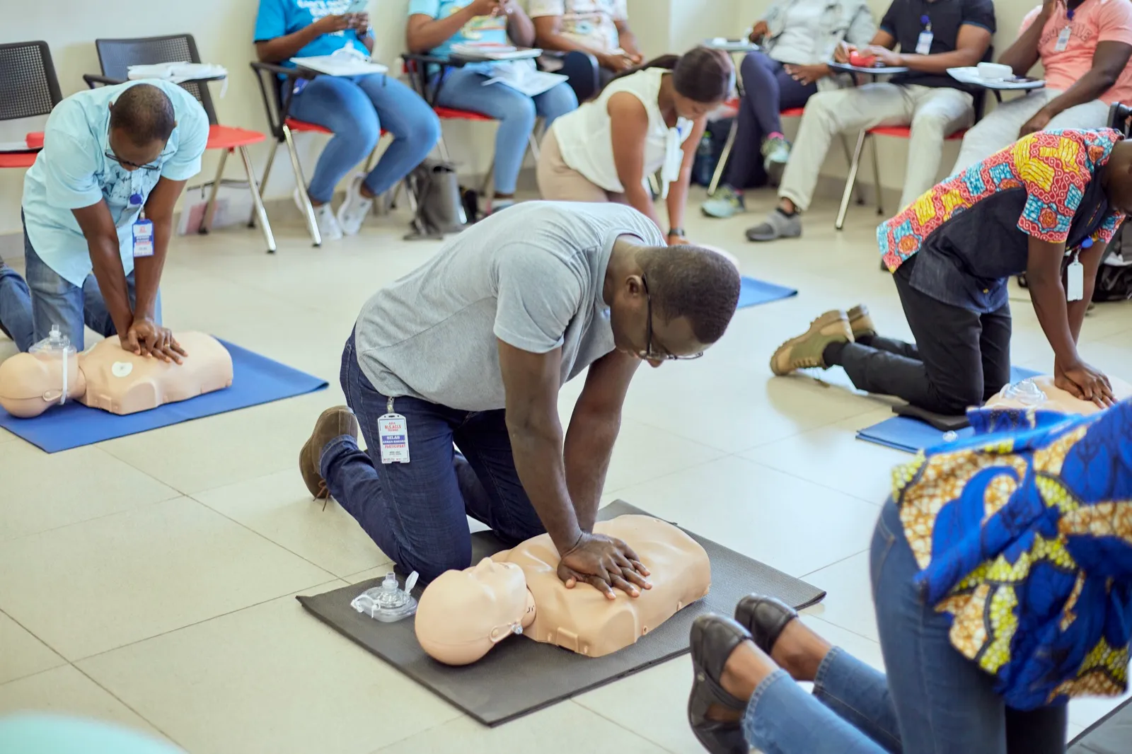 Participants practising CPR during an AHA certified training session